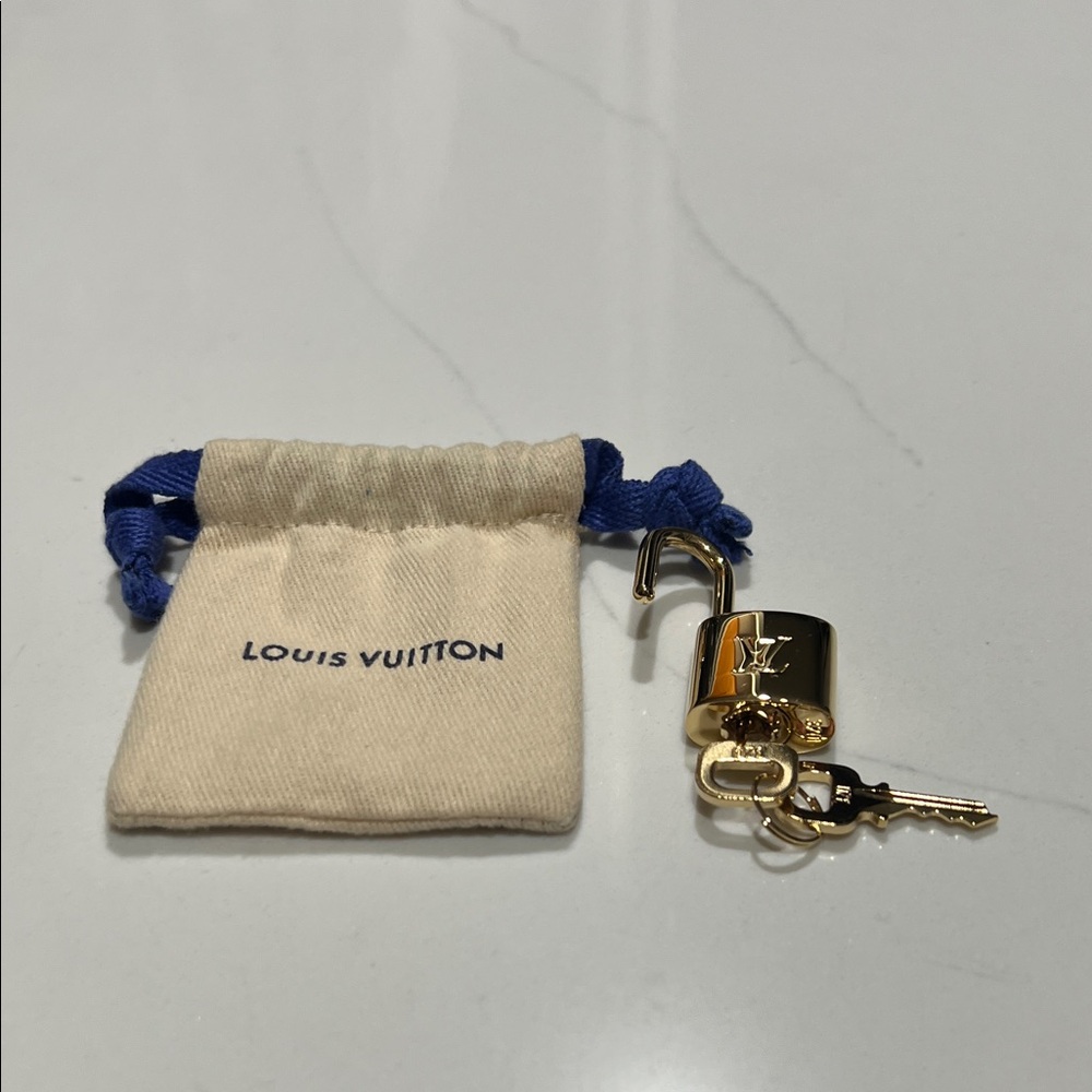 Louis Vuitton Gold lock with 2 keys .brand new.